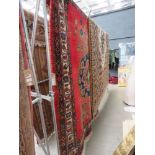 (3) 2.1m x 1.6m red carpet with central medallion