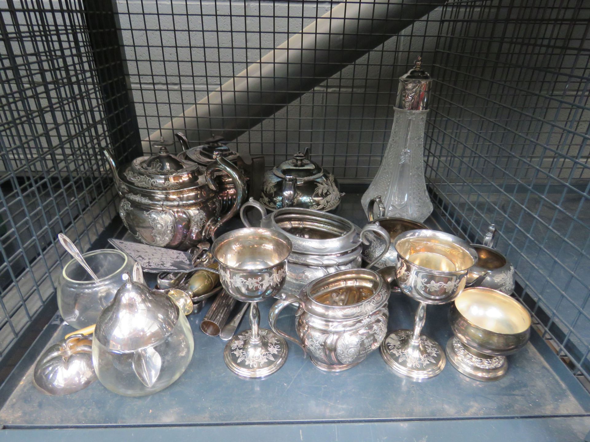 Cage containing a quantity of silver plate to include a tea service, sugar tongs, cake slice plus