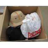 Box containing various sun hats and top hats