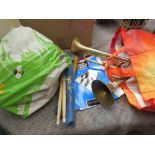 Bag containing trumpets, tambourines, and drum sticks