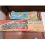 2 boxed toys, helicopter and turnpike van trailer