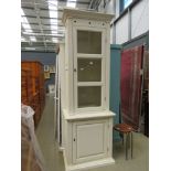 Cream painted and glazed bookcase with cupboard base under