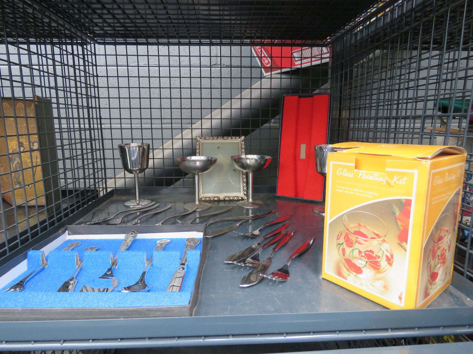 Cage containing loose cutlery, sundae bowls, photo frames plus a boxed glass vase