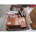 Box containing car cigarette card pictures, metal goblet, ruby glass vase, fans, matchbox labels