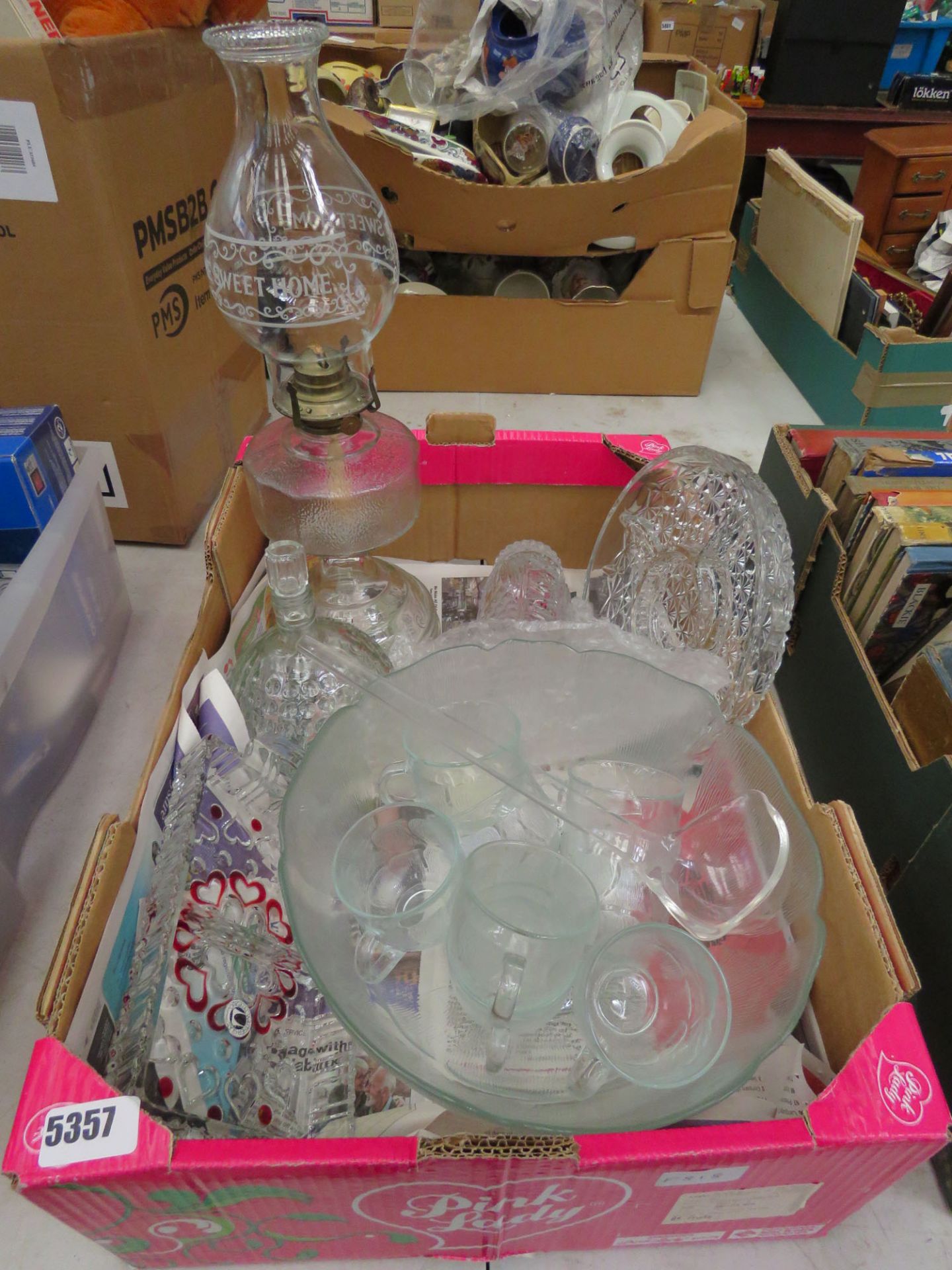 Box containing a glass punch bowl set plus an oil lamp, vase and bonbon dish