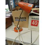 Orange painted adjustable desk lamp