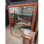 Large rectangular bevelled mirror in pine frame