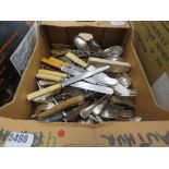 Box containing loose cutlery