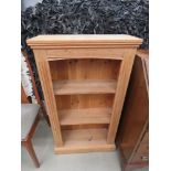 Narrow pine bookcase