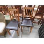 Pair of oak dining chairs with upholstered seats