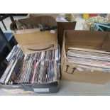 3 boxes containing vinyl records