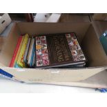 Box containing childrens' books on gardening and other encyclopedia