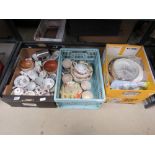 3 boxes containing various cups and saucers and other crockery plus cookie cutters and glassware