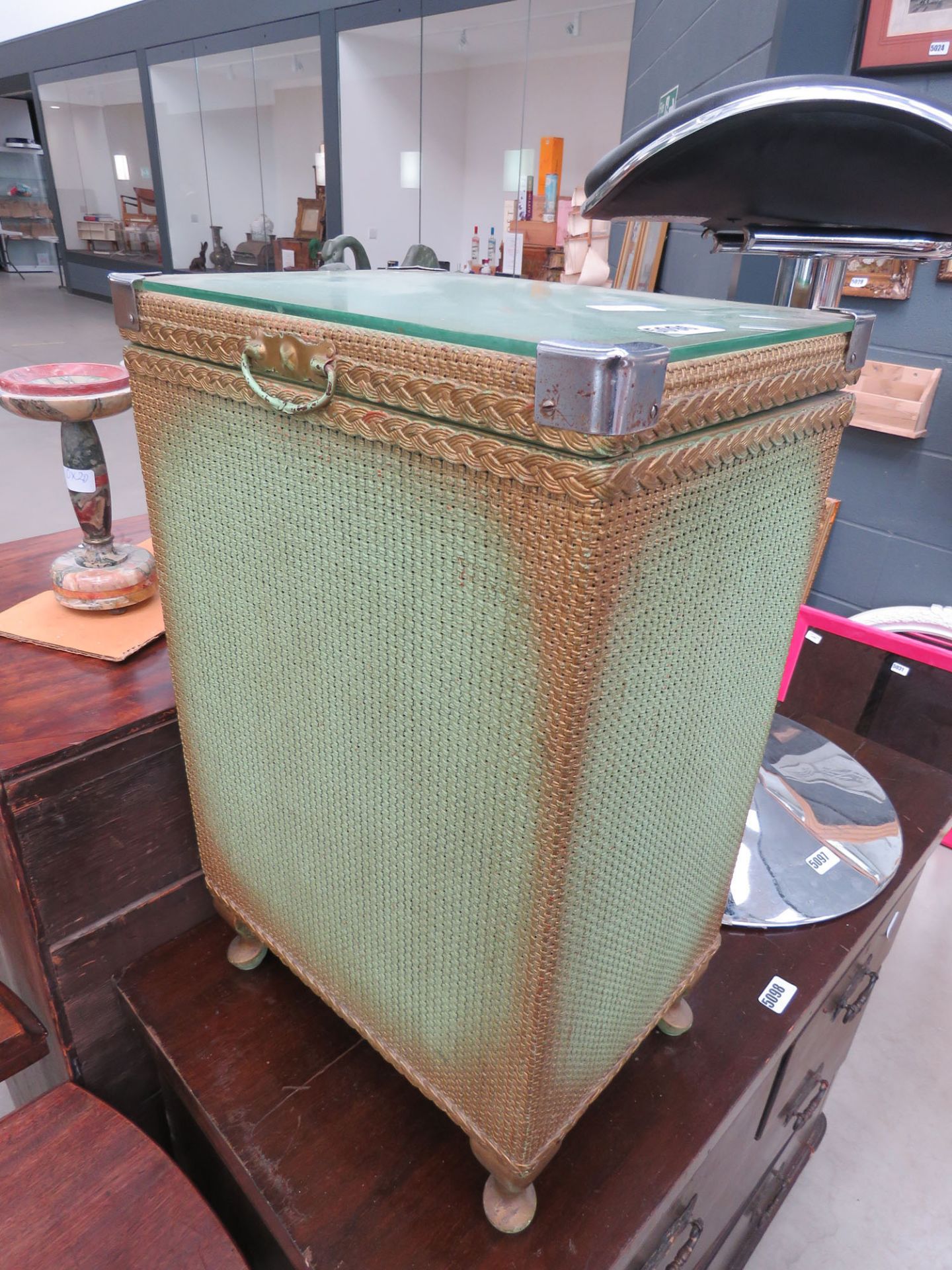 Green painted Lloyd Loom style laundry basket