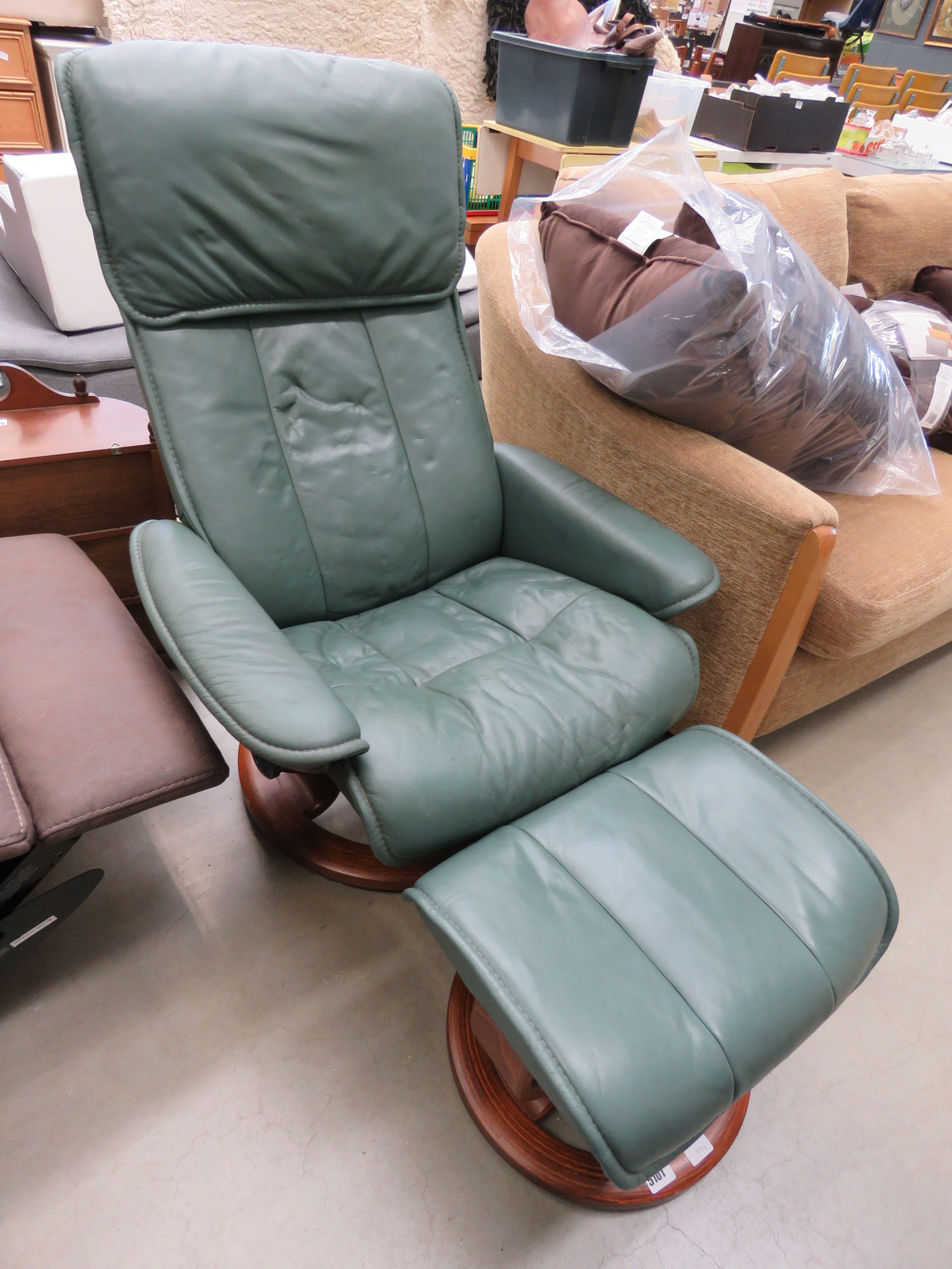 Green leather effect reclining armchair with footstool