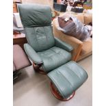 Green leather effect reclining armchair with footstool