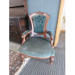 Carved Edwardian armchair with blue velvet seat and back