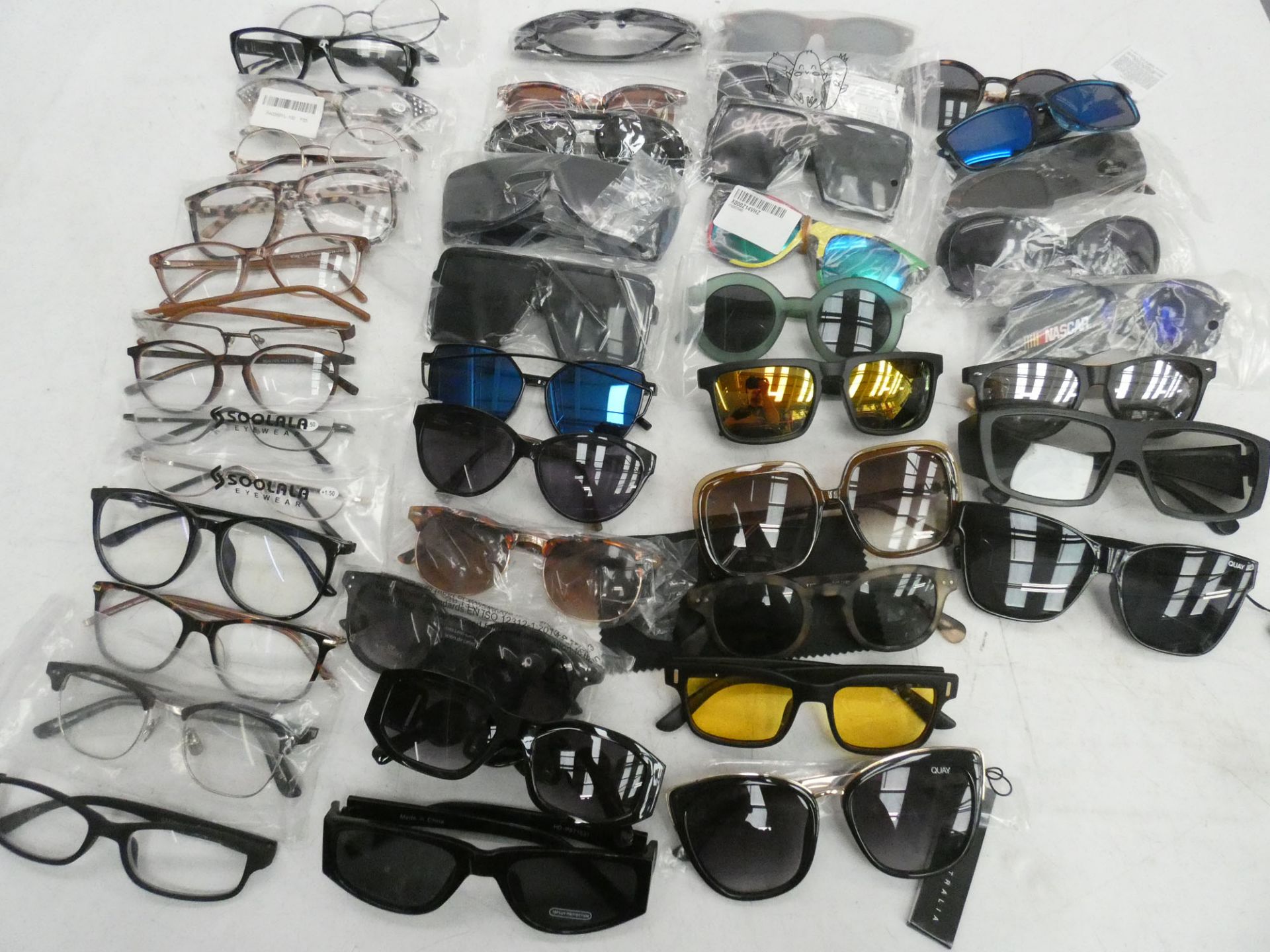 Bag containing assorted sunglasses and reading glasses