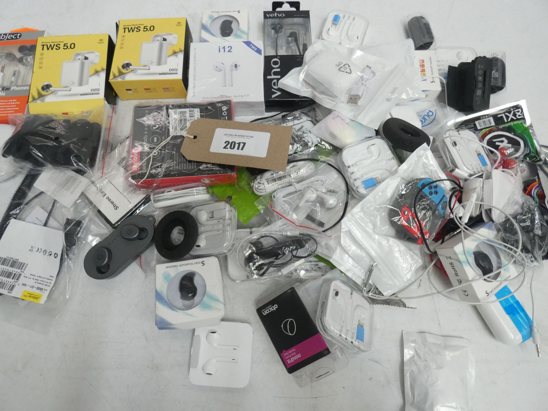 Bag containing various wired and wireless earphones