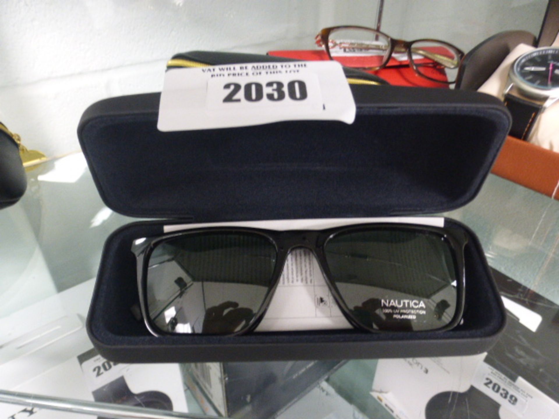 Pair of Nautica sunglasses with hard case