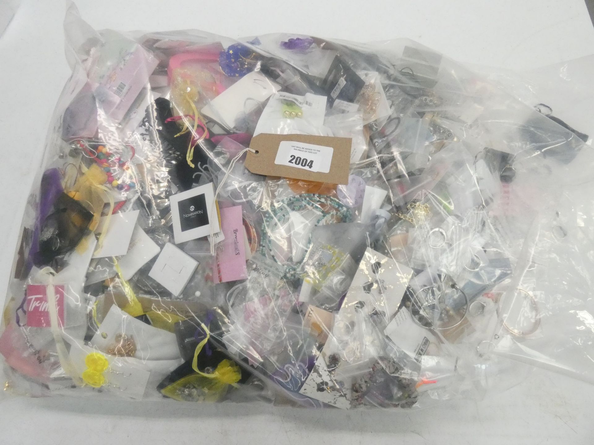 Bag containing quantity of loose costume and dress jewellery