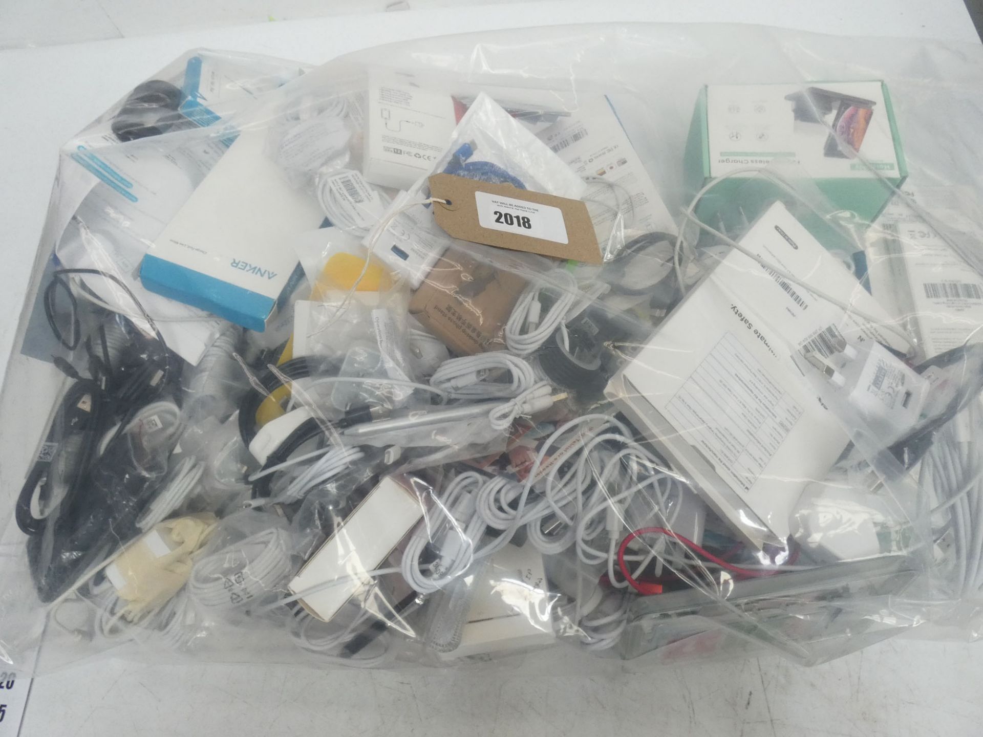 Bag containing mobile phone accessories; cables, adapters, chargers, etc