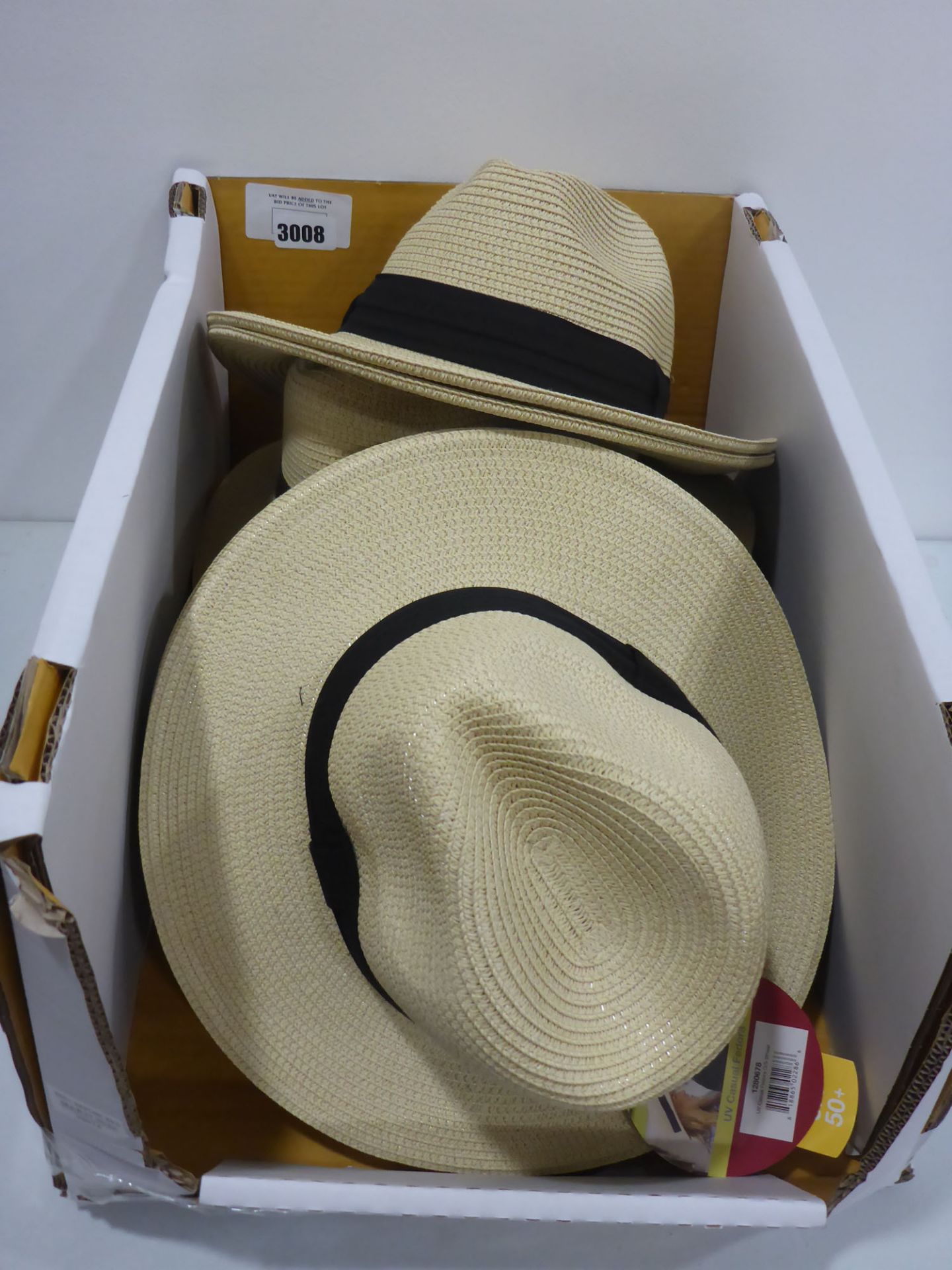 Box containing sun hats, unisex