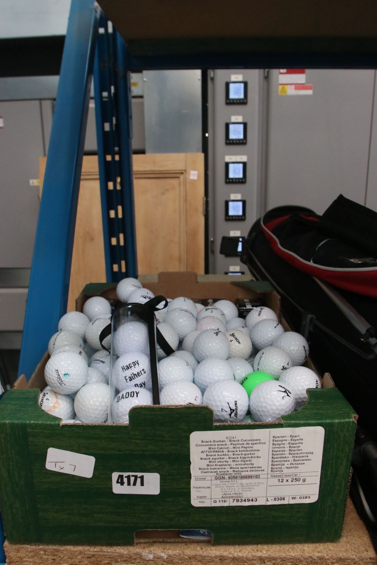 Box of assorted golf balls