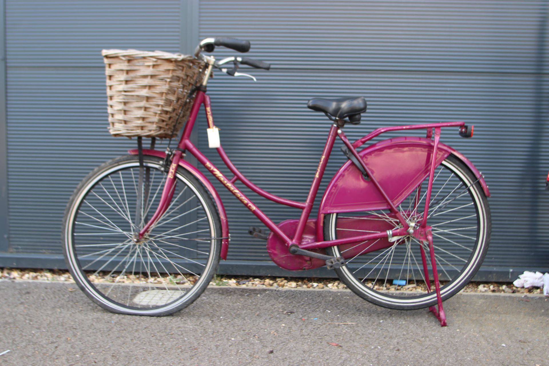 Cerise ladies bike with front basket and stand