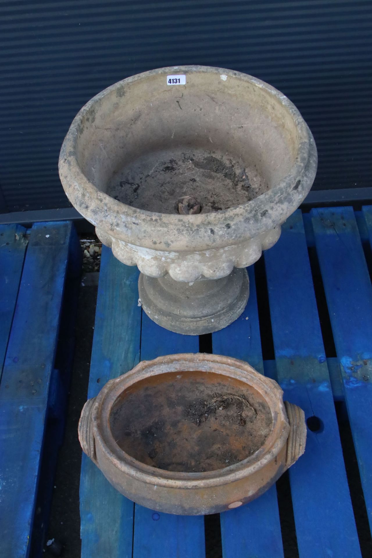 Large round reconstituted garden pot on stand and an oval pot