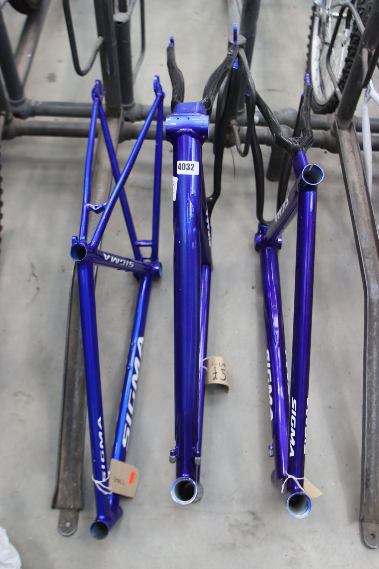 3 bright blue carbon fibre Figma bike frames sizes S and 2x XL