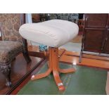 Cream leather-topped footstool on turned teak legs