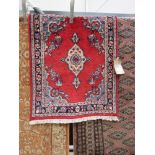 (2) Hand made Iranian rug in red and blue with floral design