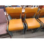 10 grey legged rexine topped stacking chairs