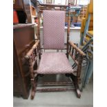 American bobbin turned rocking chair with brown and white fabric