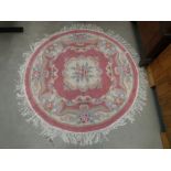 Oriental circular rug in pink with floral design