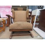 Small child's rocking chair with oak frame and floral upholstery