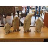 4 Assorted carved penguins