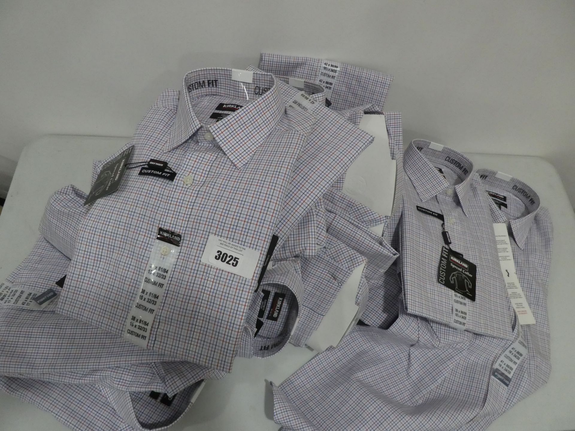 Approx 20 Kirkland checked shirts of various sizes, all tagged