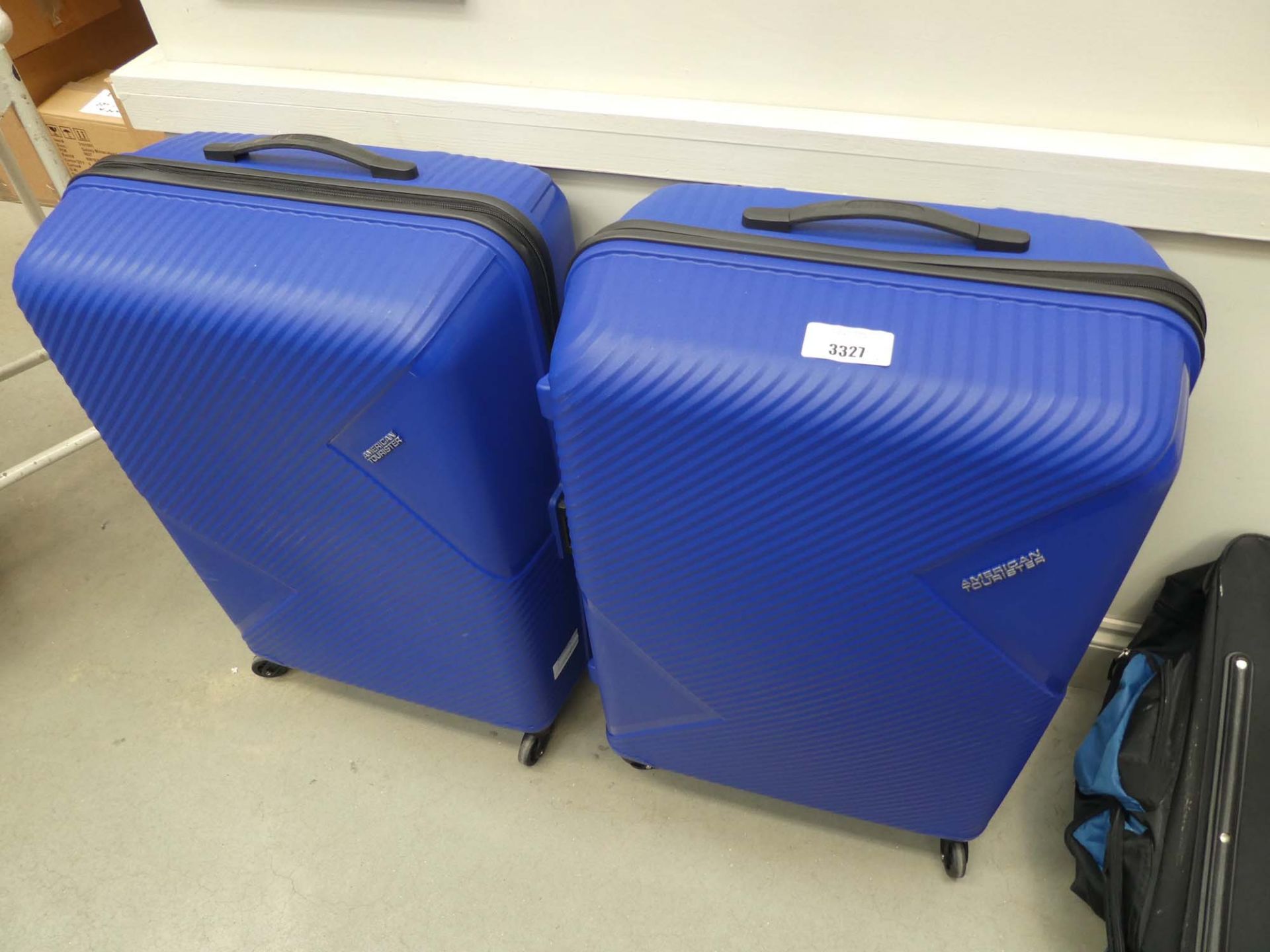2 large hard shell American Tourister suitcases