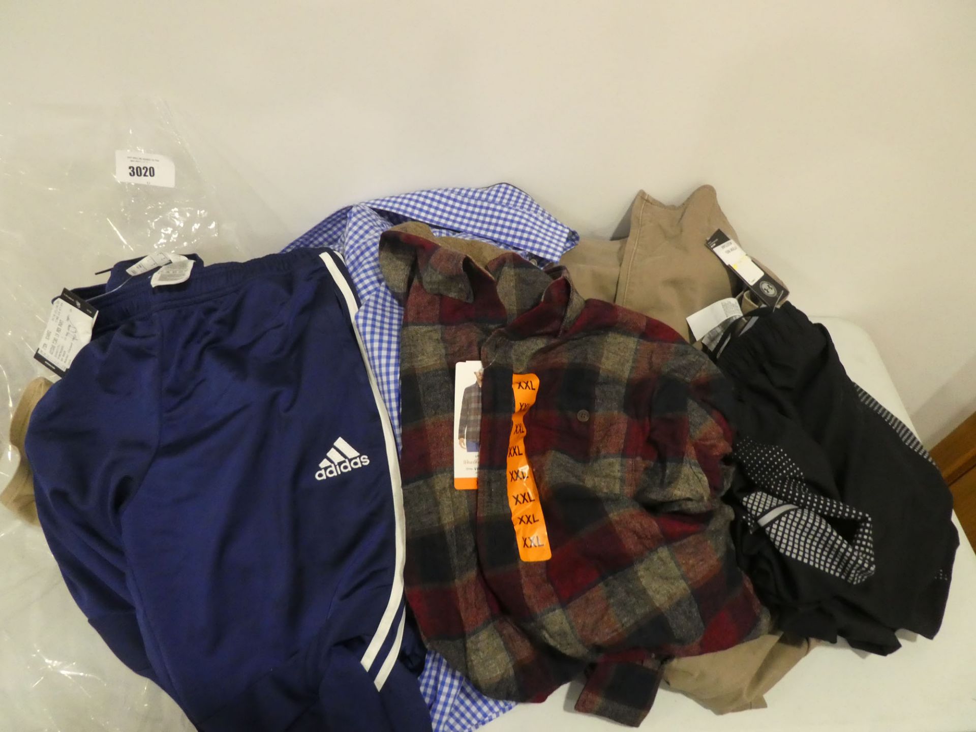 Bag of mixed men's clothing including Adidas trousers, Undre Armour shorts, Weatherproof tops, shirt