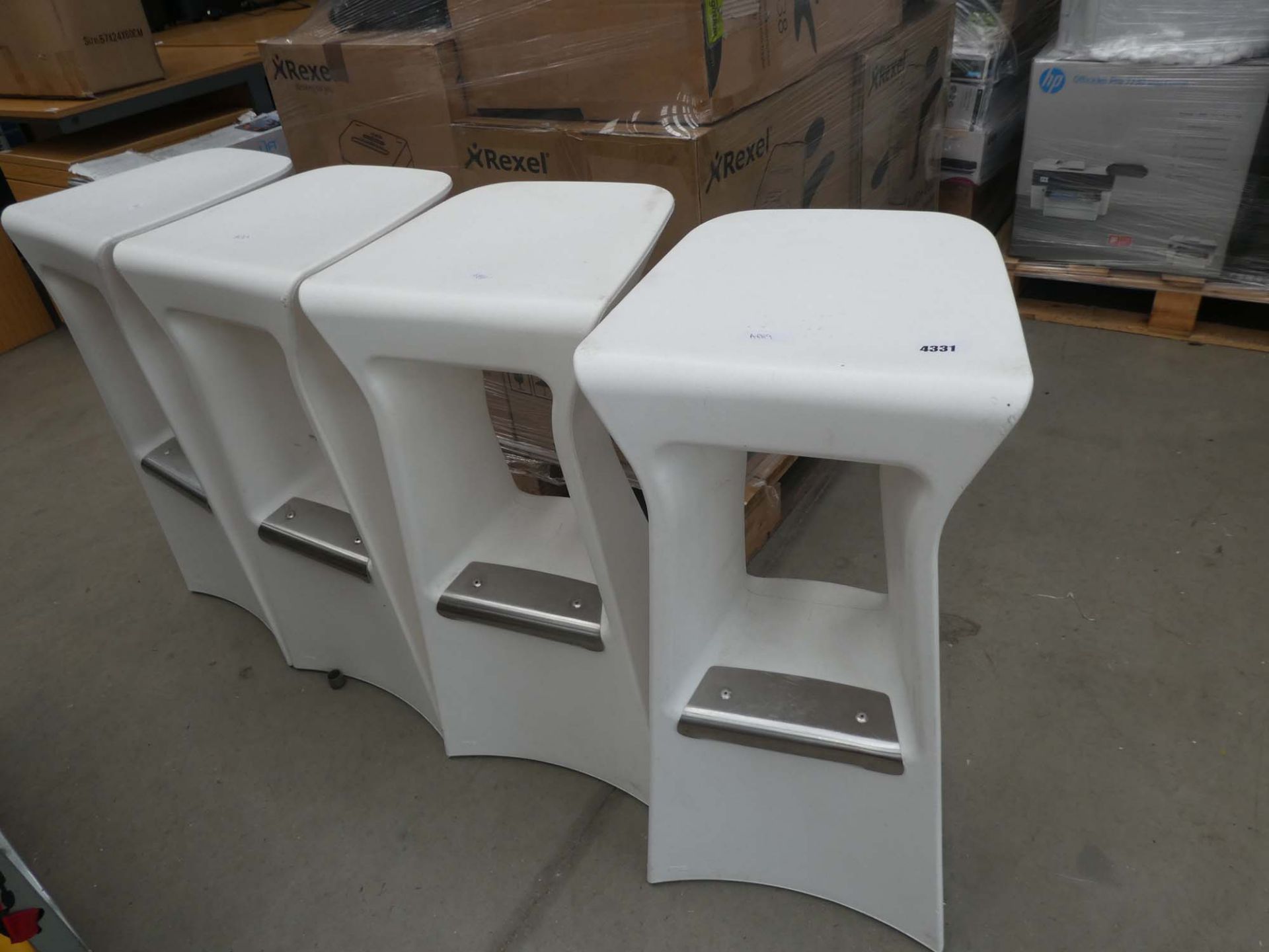 4 white plastic bar stools