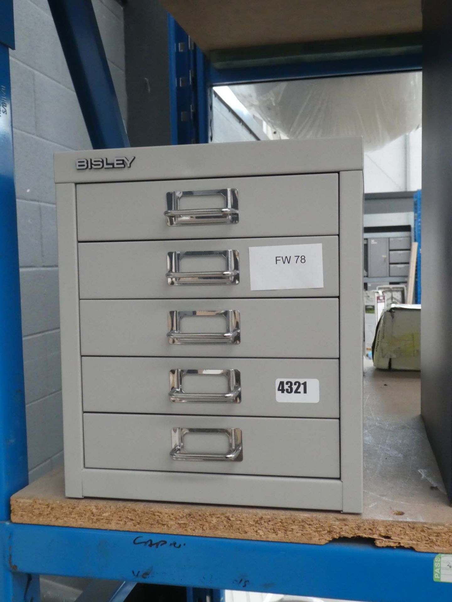 Small multidrawer grey filing cabinet