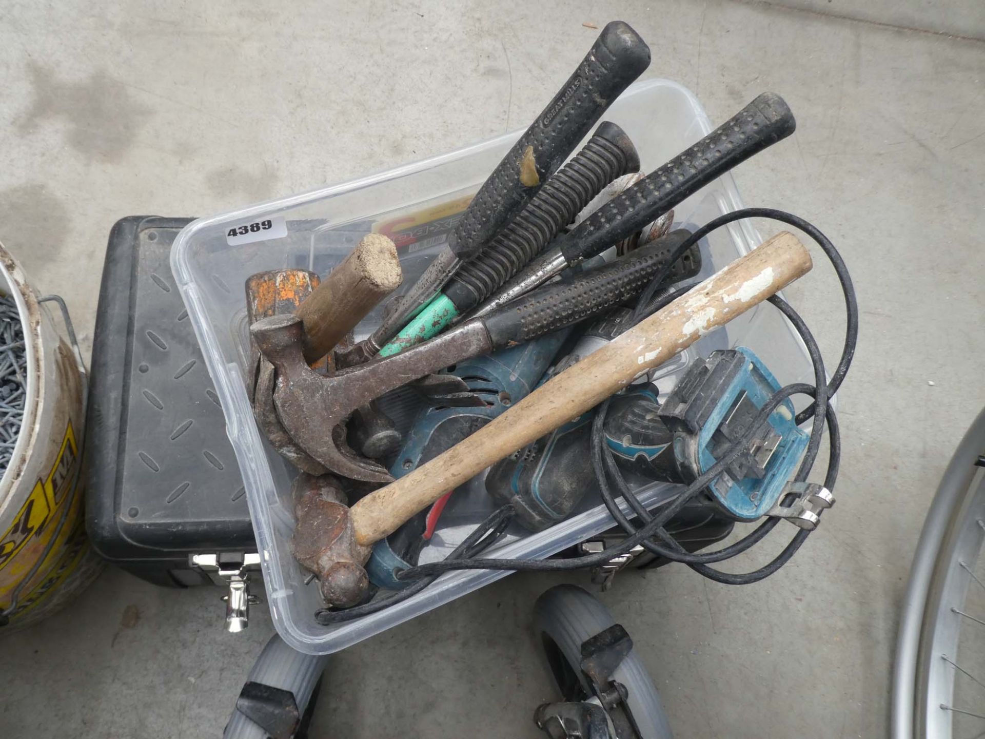 Toolbox containing tools and a small plastic crate containing hammers, drill bodies, angle