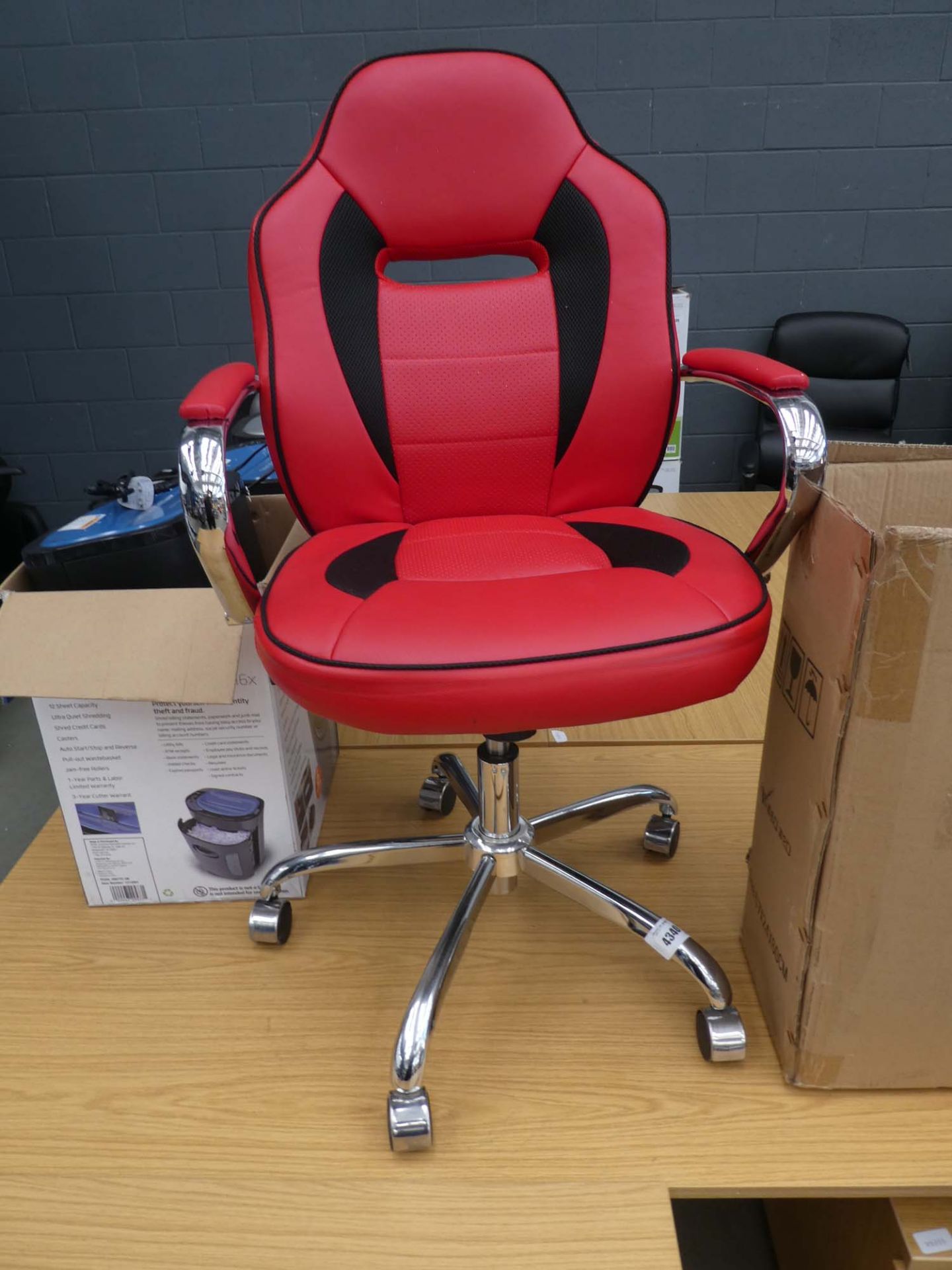 Red and black swivel armchair