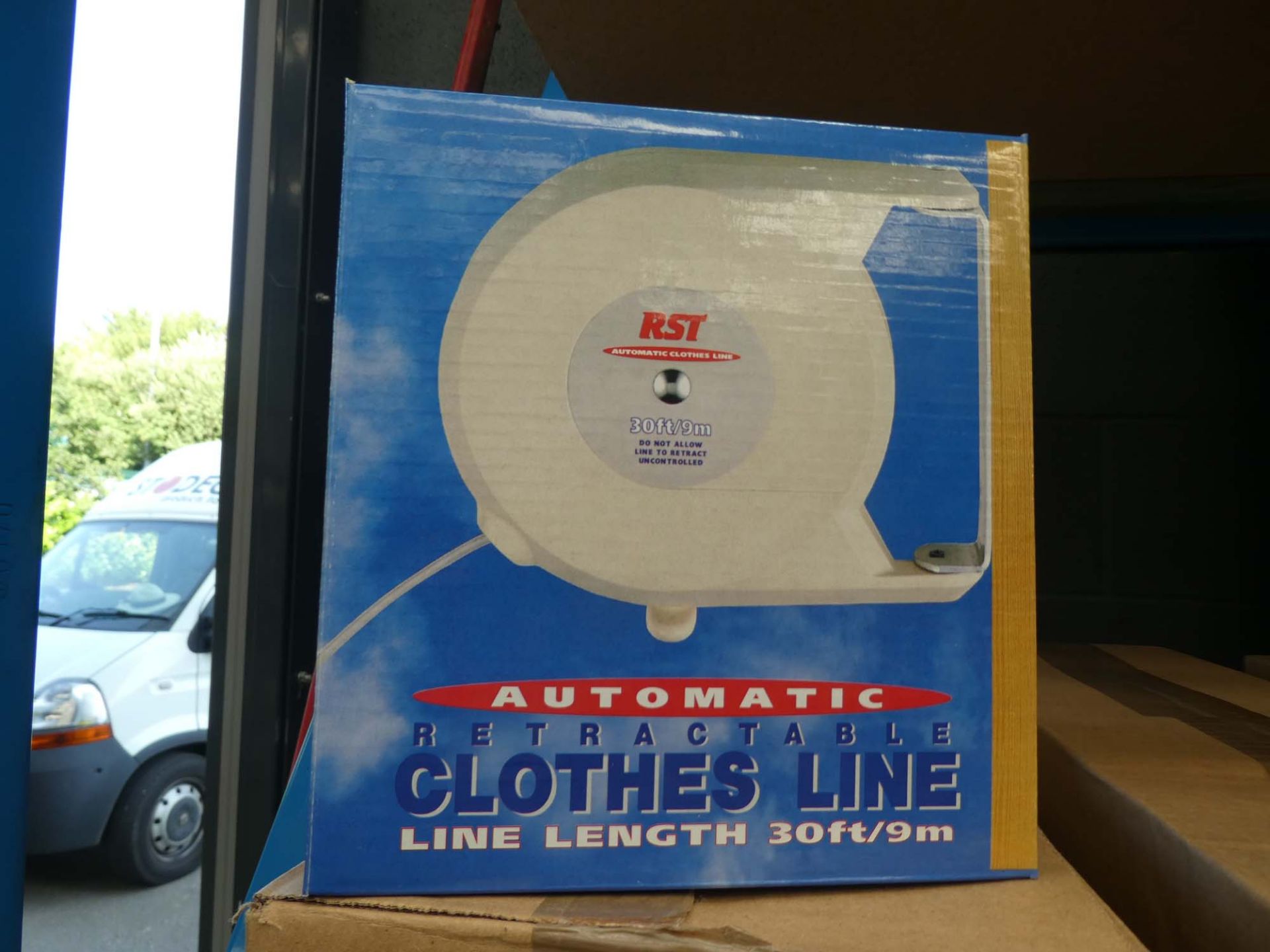 2 boxes containing 10 retractable clothes lines