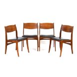A set of four 1960's Danish designed dining chairs with teak frames and black vinyl drop-in