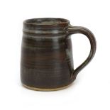David Leach (1911-2005), a stonware mug, impressed LD seal mark, h.