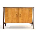 A 1950's Everest walnut sideboard inlaid in the Helix manner,