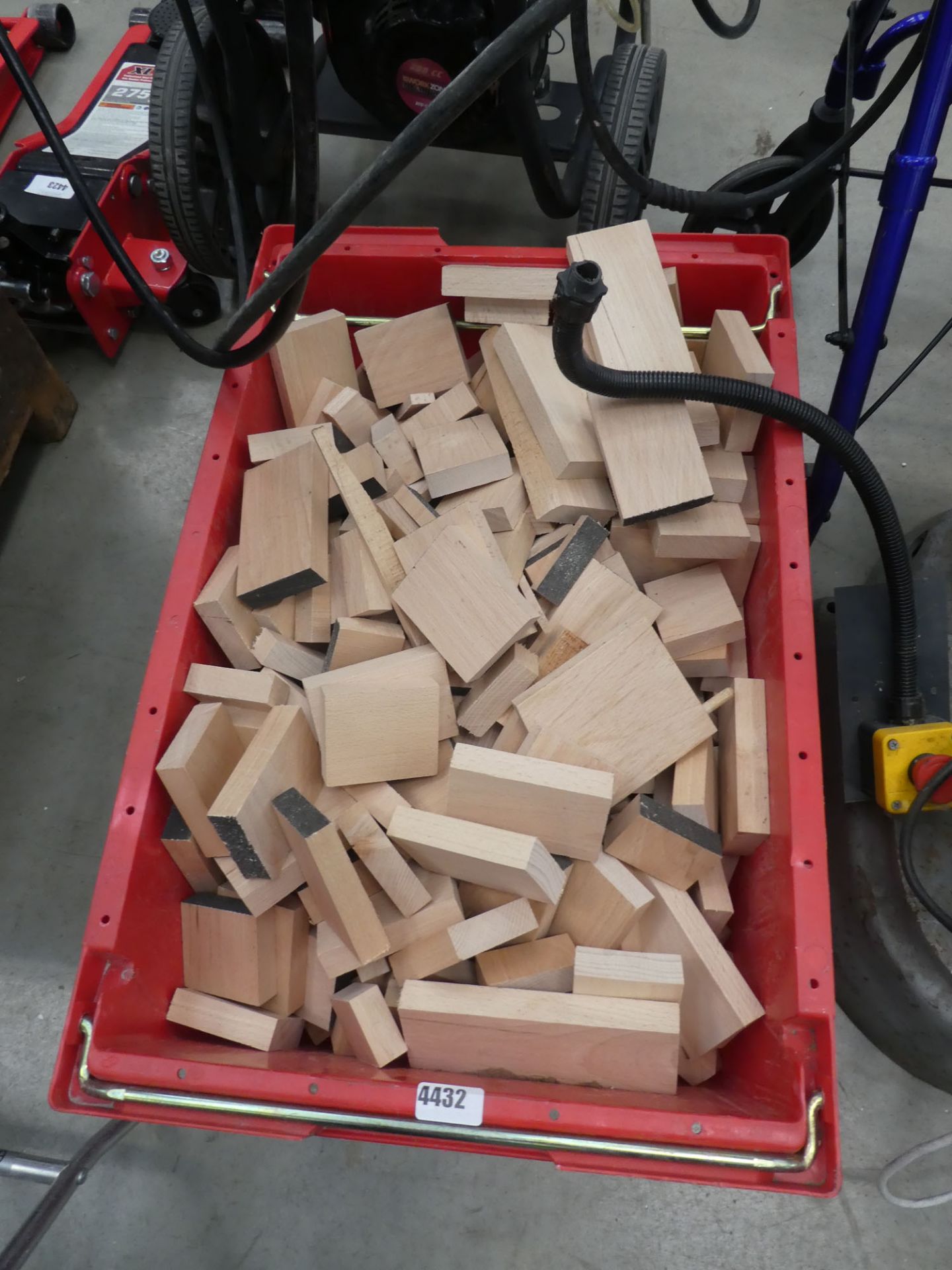 Red crate of hardwood offcuts